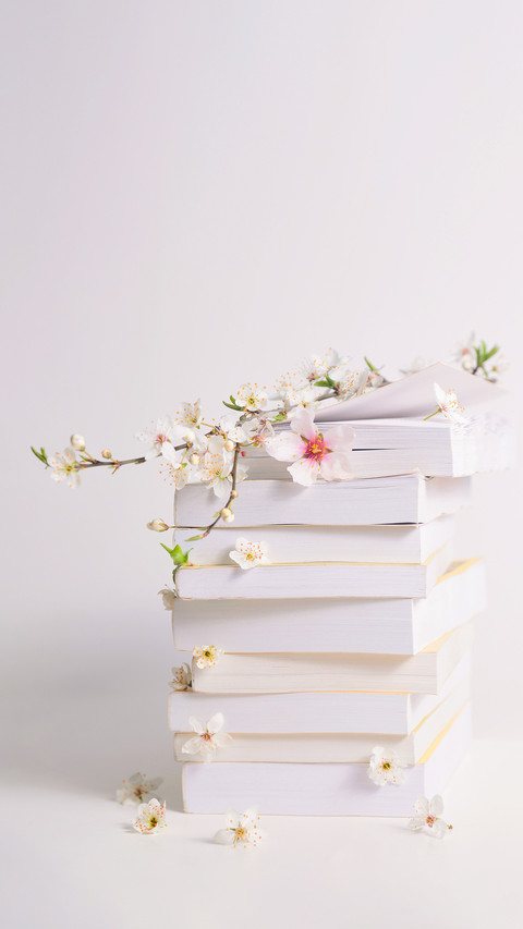 Stack of Books with Spring Flowers between Pages screenshot