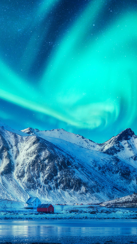 Northern lights above snowy mountains screenshot