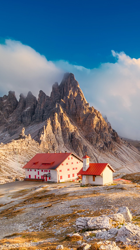 Autumn Dolomites sunset with blue cloudy sky screenshot