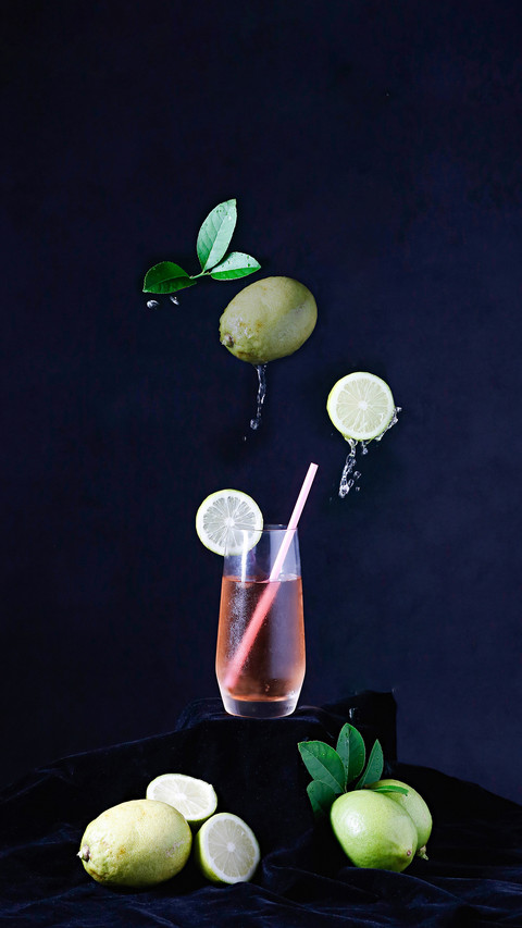 Lemon and Lemon Juice Drink on Black Background screenshot