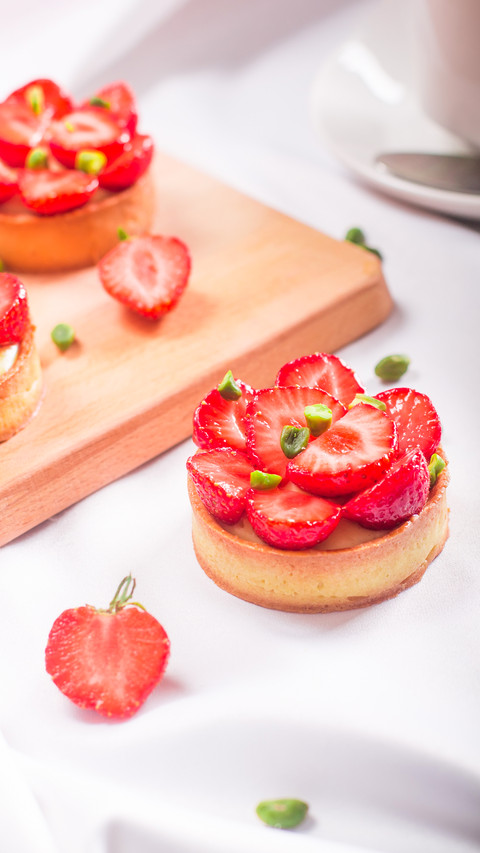 Delicious desserts with strawberries on table screenshot