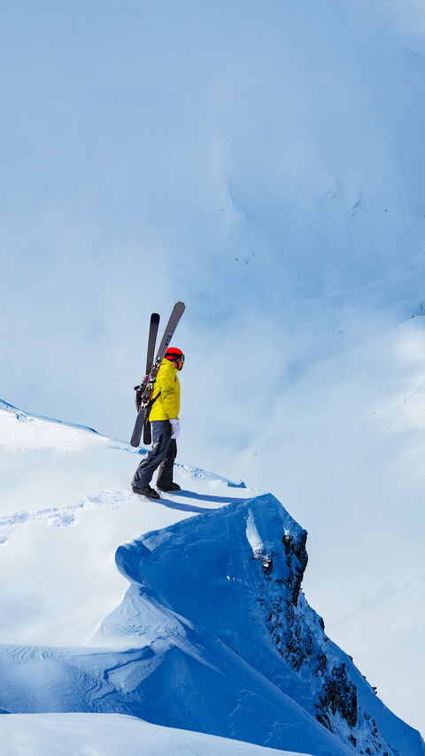 Adult man stand on the mountain top cliff with backpack screenshot