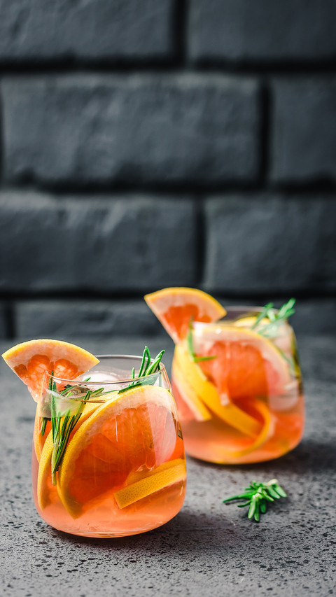 Grapefruit and rosemary infused water on dark screenshot