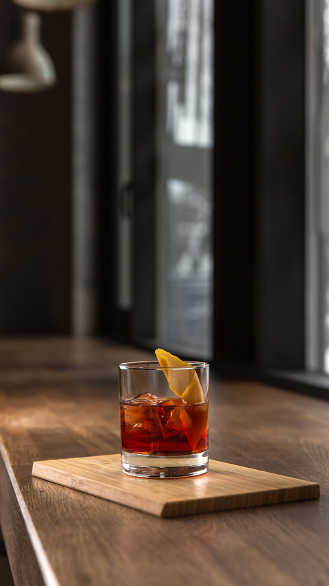 Glass of red fresh alcoholic cocktail with ice screenshot