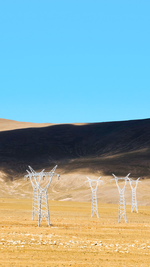 High-voltage lines and electricity pylon on the hillside screenshot