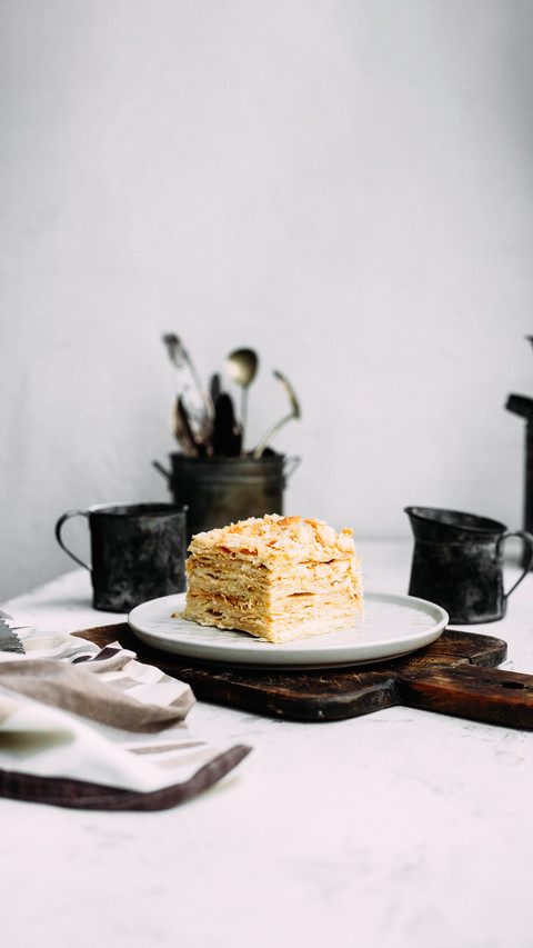 Napoleon cake in a plate on the table screenshot