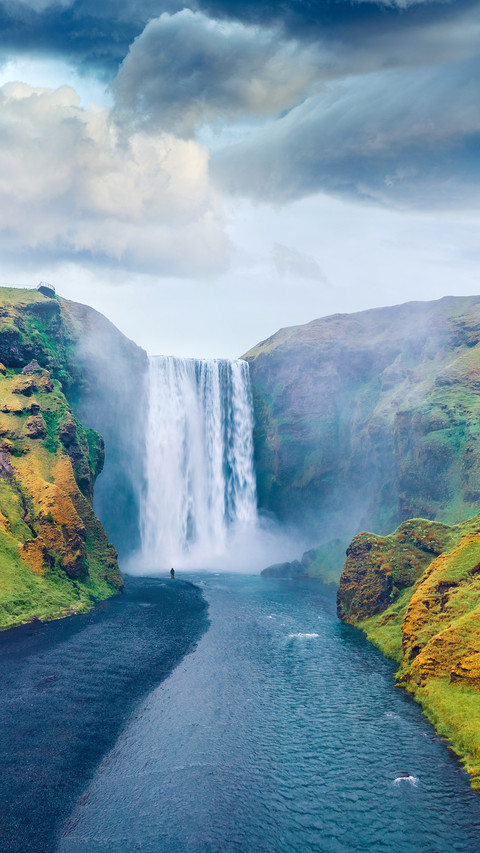 Dramatic midnight sun view of Skogafoss Waterfall screenshot