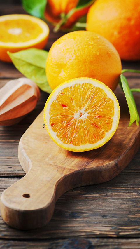 Fresh sweet oranges on the wooden table screenshot