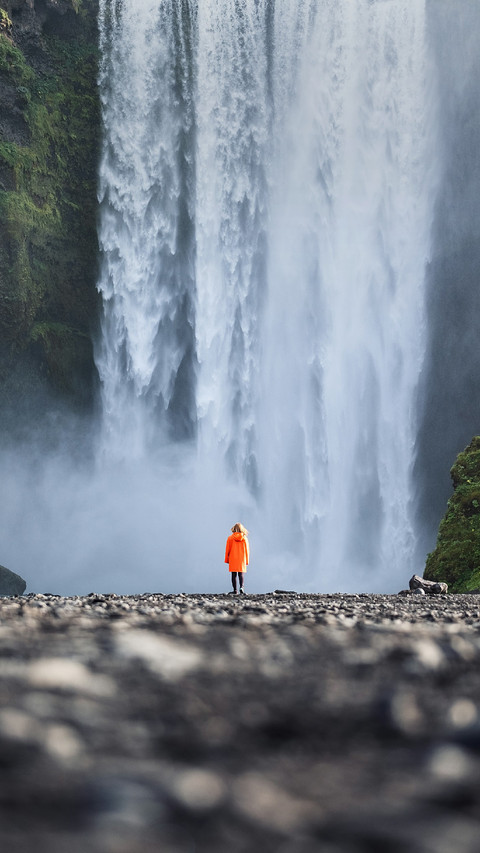 Woman Standing Alone Under The Waterfall screenshot