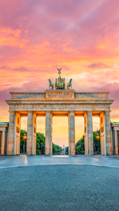 Brandenburg gate illuminated at sunset in Berlin, Germany screenshot
