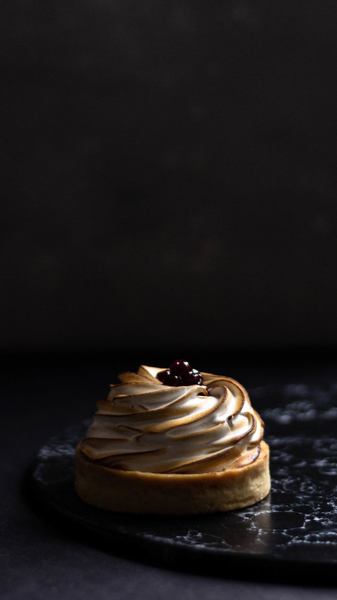 Delicious mini lemon tart with white cream and berries screenshot