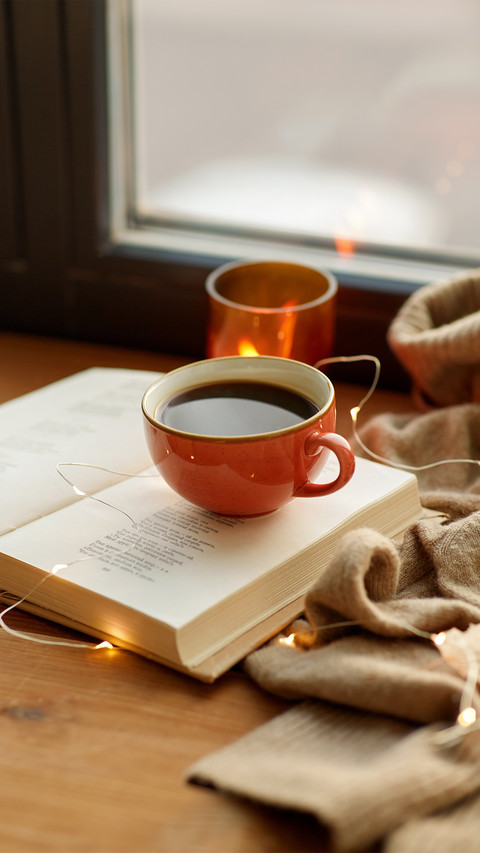 Cup of Coffee, Book, Autumn Leaves and Candle on Window screenshot