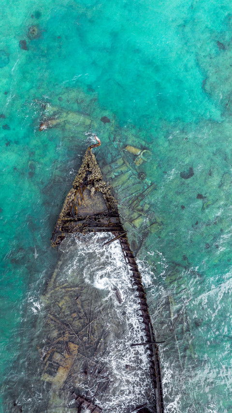 Drone overlooking sunken ship bow screenshot