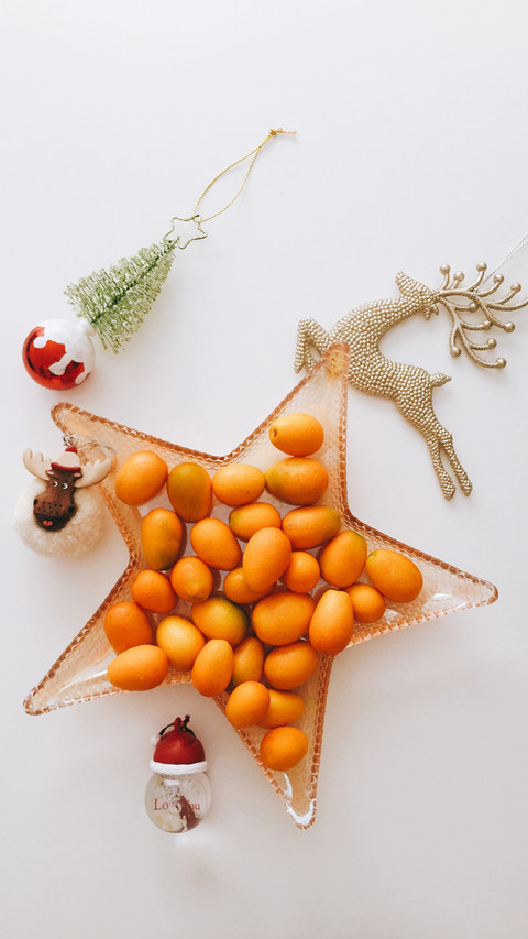 Colorful Christmas Ornaments, Citrus Fruits, and Festive Atm screenshot