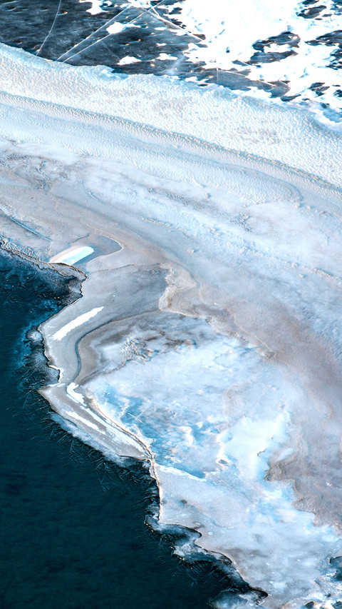 Aerial view of a frozen river in Mongolian winter landscape screenshot