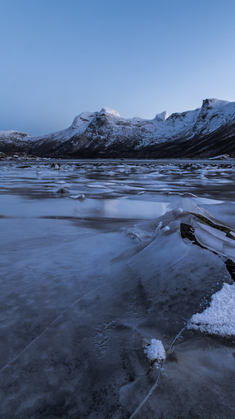 Frozen mountain lake still as a painting screenshot
