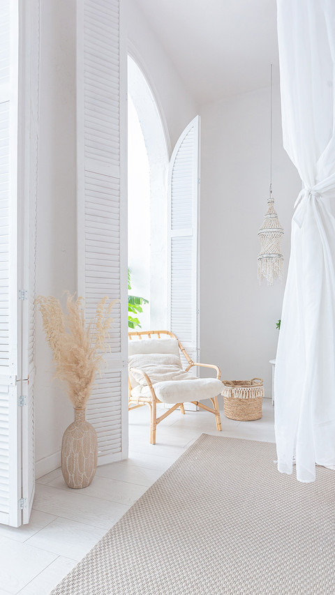 A Bright Apartment with White Walls and Bamboo Furniture screenshot