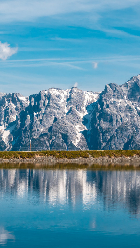 Majestic Snowy Peaks Mirrored in Deep Blue Lake screenshot