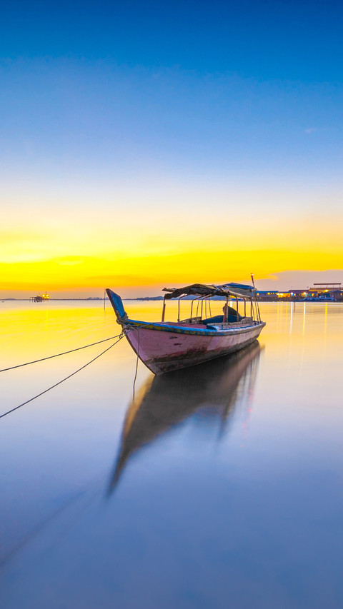 Fisherman boat parking with beautiful light of sunset screenshot