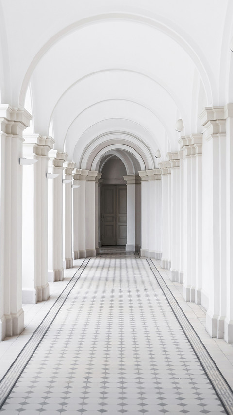 White arch corridor with tiled floor in 19th century screenshot