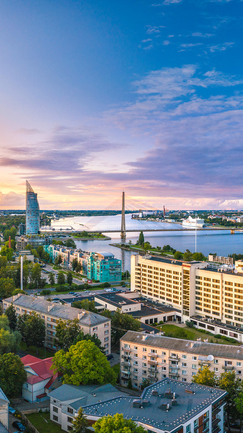 Riga city panorama with colorful sunset in the sky screenshot