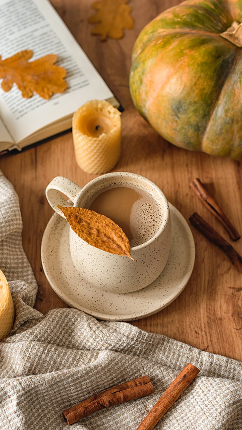 a mug of fragrant cocoa, wax candles, dry leaves screenshot