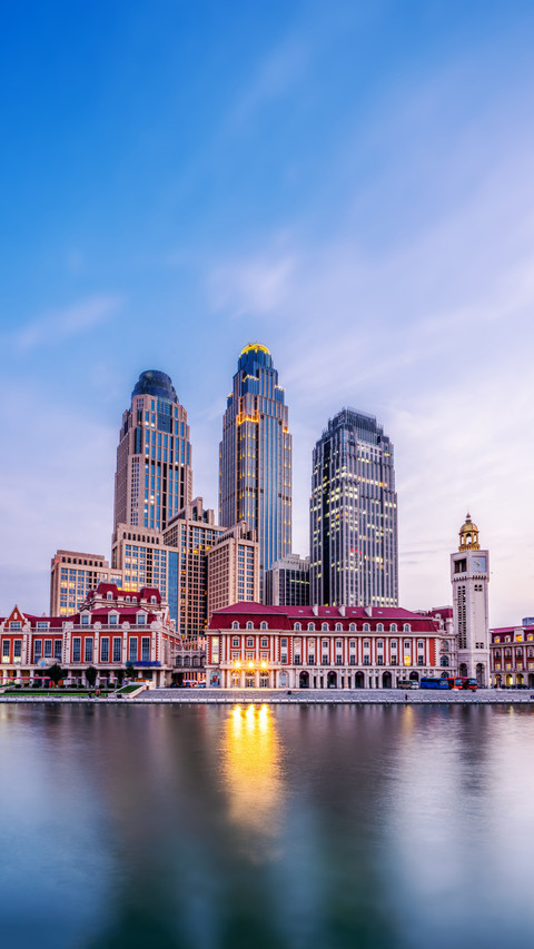 Modern Skyline Reflected in River, A City's Nighttime Charm screenshot