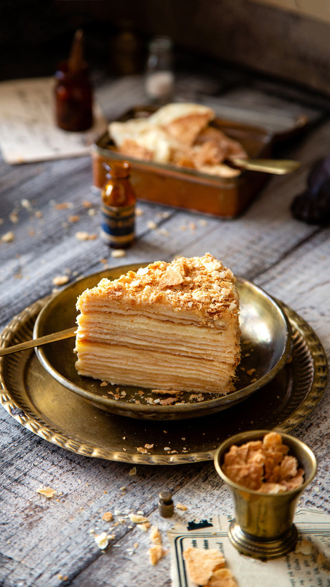 Russian cake napoleon on vintage gold metal plates screenshot