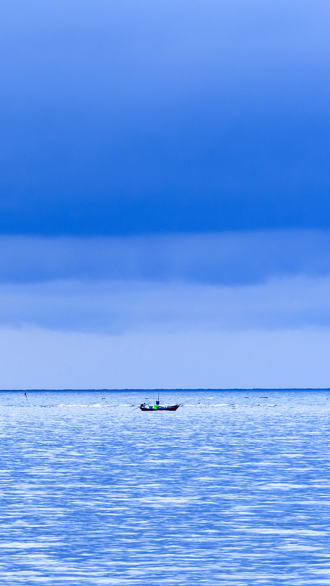 Floating fishing boats aground at the harbor over cloudy sky screenshot