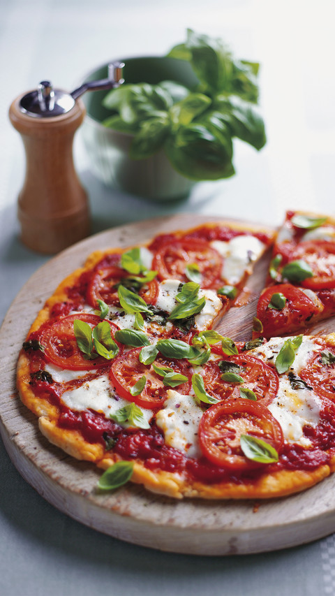 Pizza margherita topped with tomato sauce sliced tomatoes screenshot