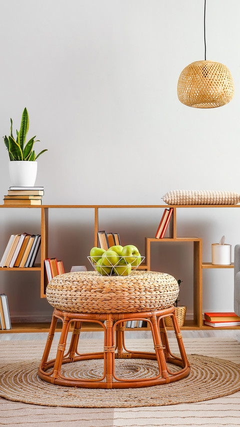 Basket with green apples on wicker table in stylish room screenshot