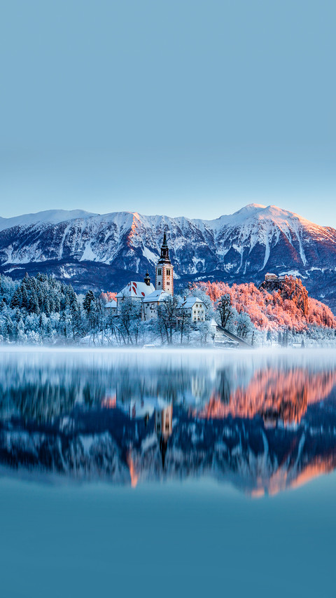 Beautiful lake Bled in Slovenia on a snowy winter morning screenshot