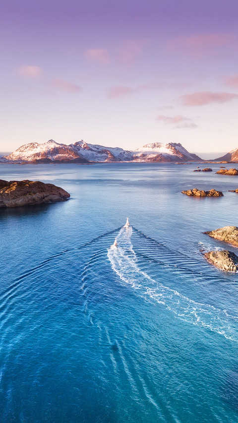 Boats on the sea during bright sunset screenshot