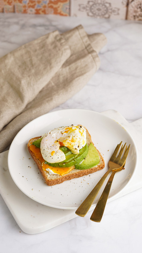 A toast bread with cream cheese on a white plate screenshot