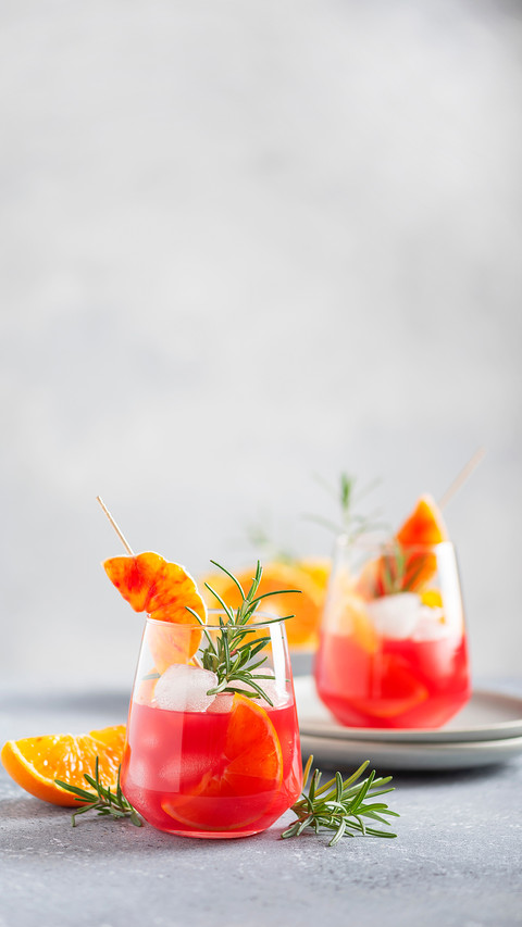 Cocktail with red oranges, rosemary and ice screenshot