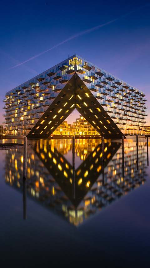 Modern Architecture Mirrors Sky and Water in Deep Blue Hour screenshot