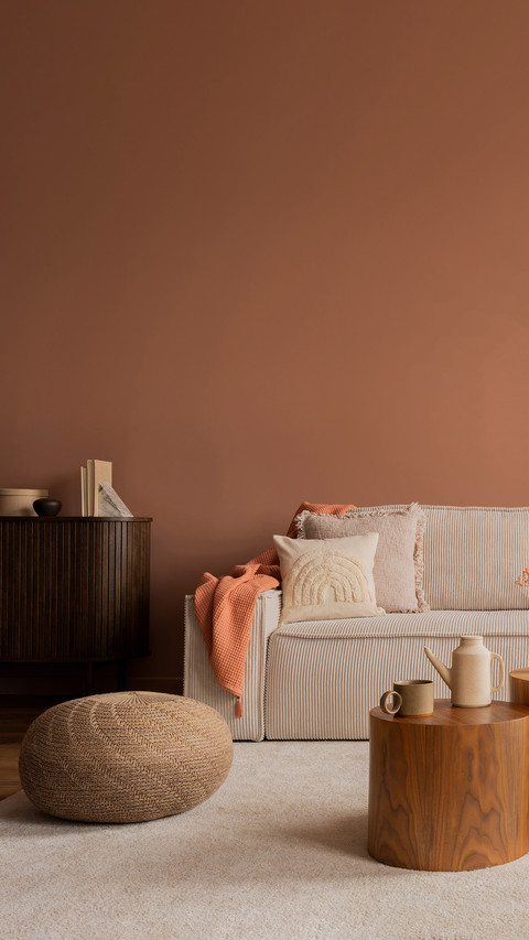 Warm and cozy living room interior with mock up poster frame screenshot