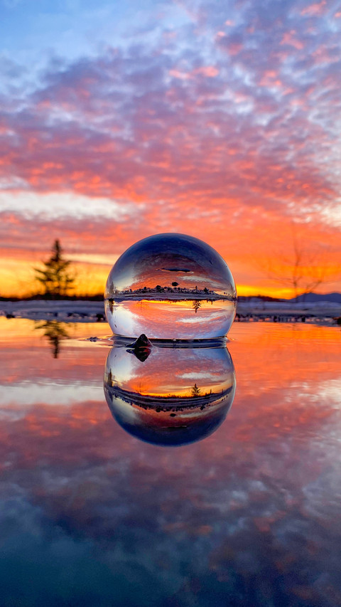 Beautiful sunset captured by the lens ball screenshot