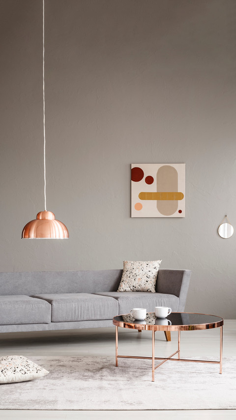 Cups on a shiny, copper golden coffee table in living room screenshot