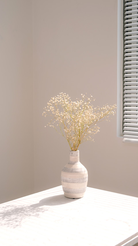 Beautiful spring flowers in vase on window screenshot