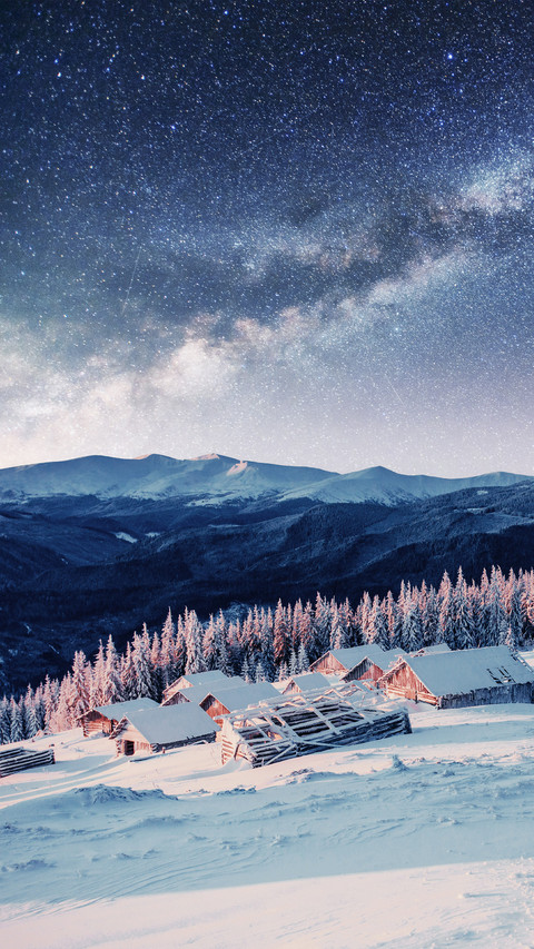 Snowy Mountains And wooden Houses Under The Stars screenshot
