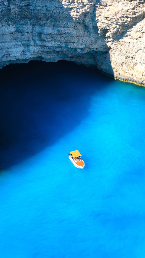A boat in the lagoon near Navagio Beach screenshot