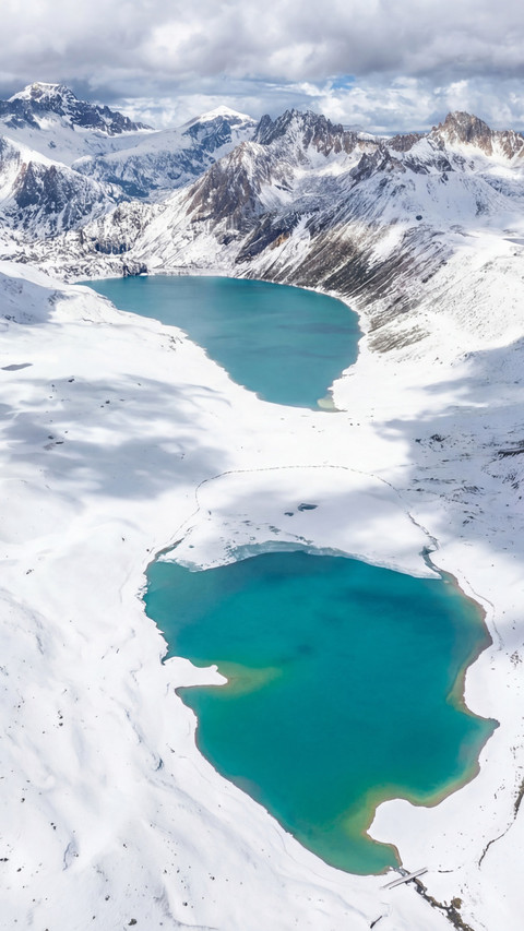 Aerial footage of Haizi Mountain Sister Lakes in winter snow screenshot