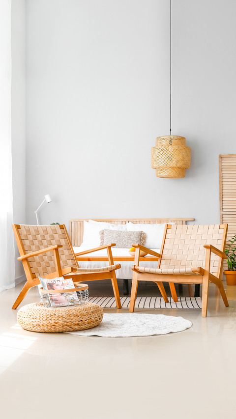 Interior of modern bedroom with wicker armchairs screenshot