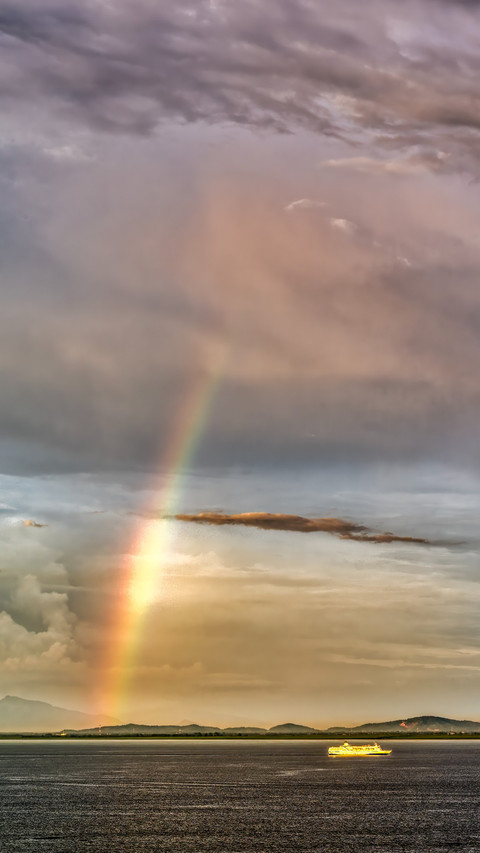 Rainbow on the sea at sunset screenshot