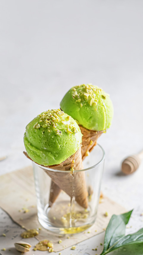 Two pistachio ice cream cones in a glass screenshot