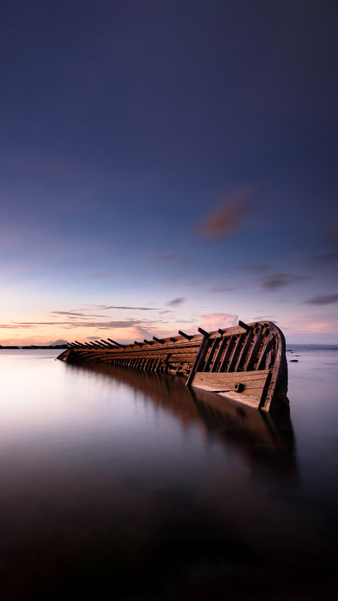 Sinking ship shot at dusk using long exposure technique screenshot
