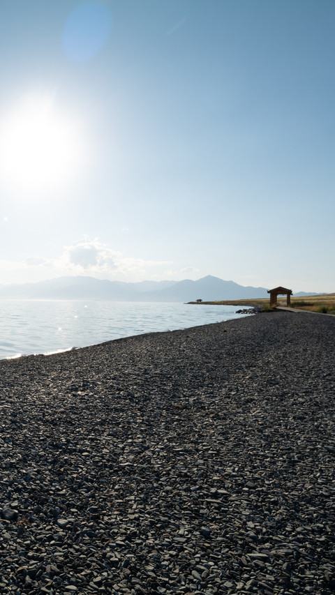 The reflection of cars on the surface of sayram lake screenshot