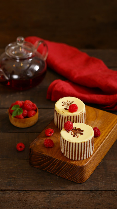 Three chocolate cake with fresh raspberries screenshot