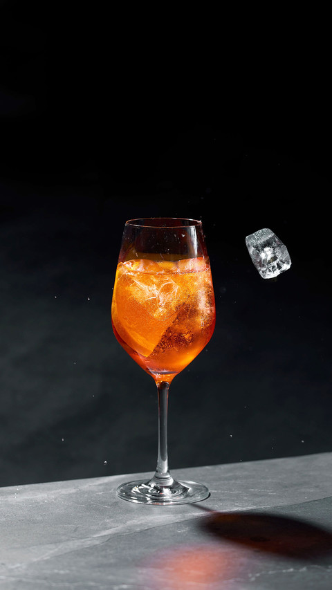 A refreshing cocktail in a glass with ice cubes screenshot